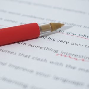 red pen with editing markup