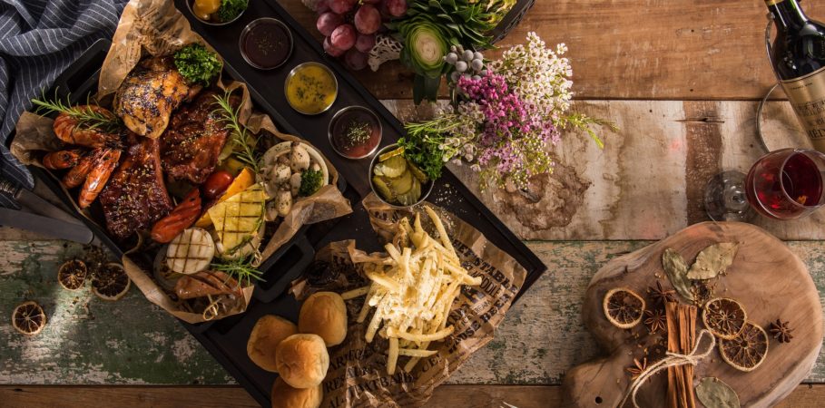 table top decoratively arranged with a platter of food