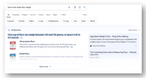 Screenshot of Google search bar with search "how much does flour weigh" and the AI generated search results. King Arthur brand flour has the top result.