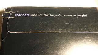 envelope with tear strip marked "let the buyer's remorse begin"
